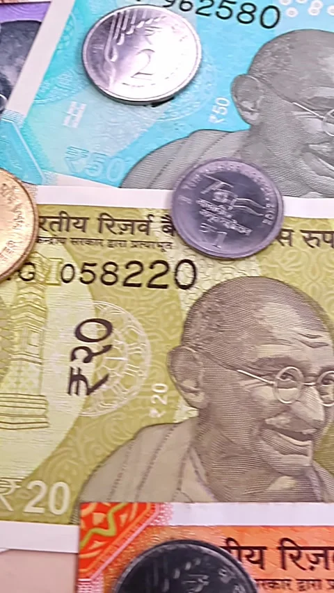 Close up view of brand new indian rupees coins and banknotes. Stock Footage 291850287