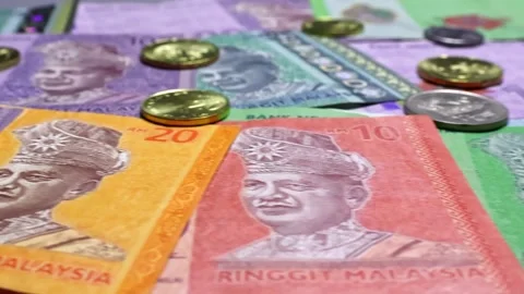 Close up view of brand new malaysian ringgit banknotes, coins. Stock Footage 302274341