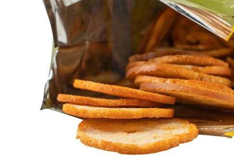 Close-up view of bread crisps inside an opened package. Stock Photos