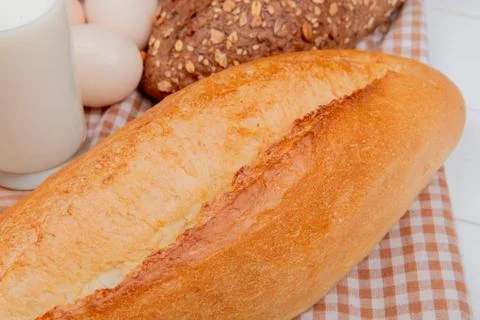 Close-up view of breads as black seeded and vietnamese baguette with eggs mil Stock Photos