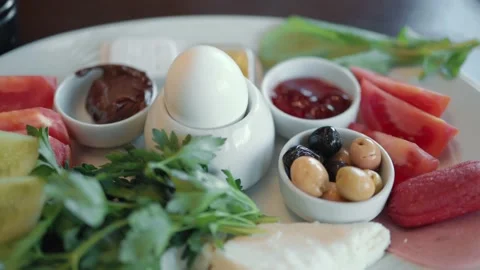 Close up view of breakfast plate with variety of products. Slow motion Stock Footage 189354474