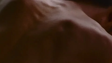 Close up view of breathing man's back muscles Stock Footage 332761860