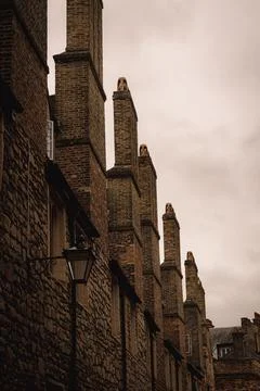 Close view of brick brown chimneys in the Trinity lane street in the center o Stock Photos