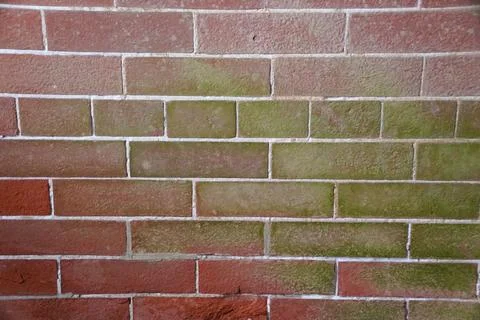 A close-up view of a brick wall with the varied shades of reddish-brown and.. Stock Photos