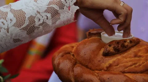 Close up view of bride salting bread due to traditions Video stock 67758359