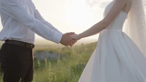 Close up view of bride's and groom's hands Video stock 157654271