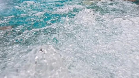 Close-up view of bright blue bubbling water filled with bubbles. Stock Footage 340064427