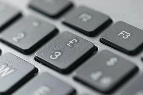 Close up view of british pound stirling icon on a computer keyboard keys Stock Photos
