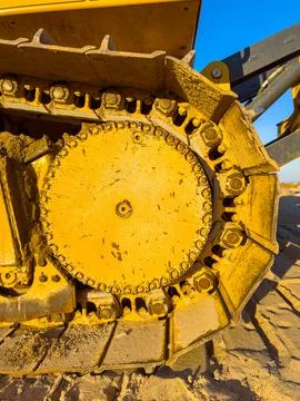 Close view of a bulldozer track system during construction work at a buildi.. Stock Photos