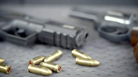 Close up view of bullets and handguns. Stock Footage 95889312