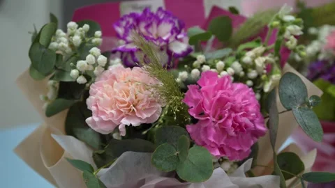 Close-up view of a bunch of flowers on the table. Видео 281942490