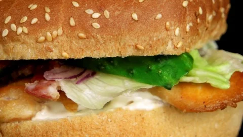 Close-up view of Burger with grilled chicken, loop Stock Footage 75253854