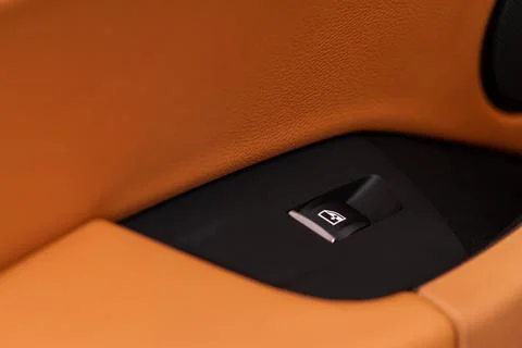 Close up view of button controlling window in modern car interior. Vehicle in Photos