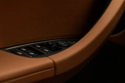 Close up view of button controlling window in modern car interior. Vehicle in Stock Photos