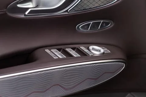 Close up view of button controlling window in modern car interior. Vehicle in Photos