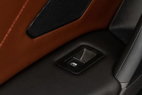 Close up view of button controlling window in modern car interior. Vehicle in Stock Photos