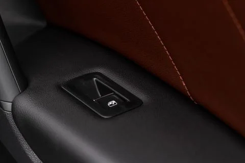 Close up view of button controlling window in modern car interior. Vehicle in Photos