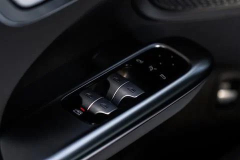 Close up view of button controlling window in modern car interior. Vehicle in Photos