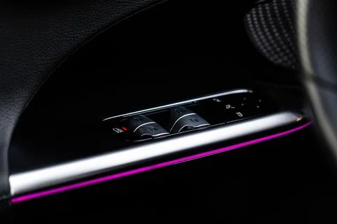 Close up view of button controlling window in modern car interior. Vehicle in Stock Photos