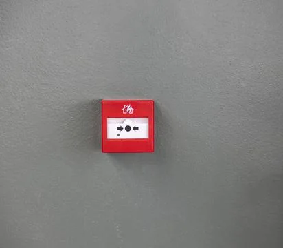 Close up view of button fire alarm. Greece. Stock Photos
