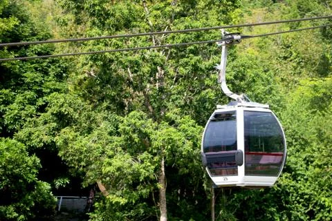 Close up view of cable car cabin with background of trees Stock Photos
