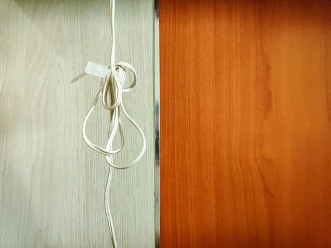 Close up view of cable ties on white and brown background Stock Photos