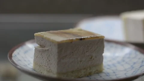 Close up view on cake with cream soft focus low light Stock Footage 163078586