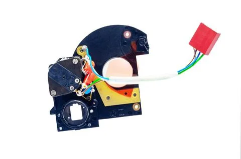 Close-up view of a camera shutter mechanism with wires and a red connector .. Stock Photos