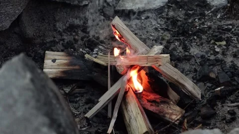 A close-up view of a camp fire burning in the evening at a campsite Stock Footage 283600169