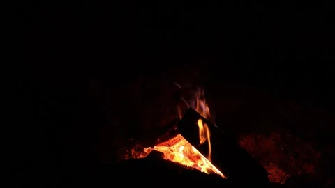 A close-up view of a campfire burning in the evening at a campsite Video stock 283601651