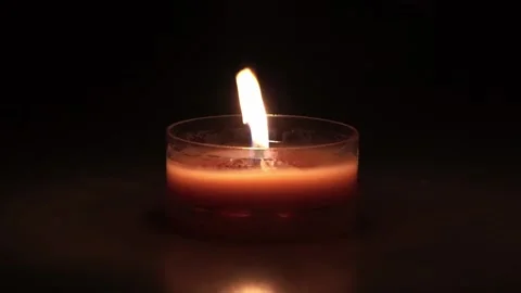 Close Up view Candle Flame Isolated On Dark Background. Video stock 200961895