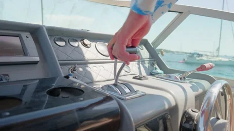 Close-up view of a captain's hands adjusting the throttle levers on the Video stock 337409821