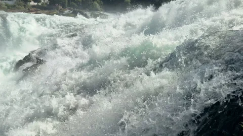 Close view captures turbulent white water flowing over Rhine Falls outdoors Stock-Footage 345251937