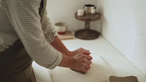 Close-up view capturing the hands of a ceramic artist from Argentina kneadi.. Stock Footage 274164156