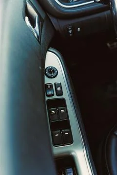 Close view of car control panel with buttons for windows and locks located on Stock Photos