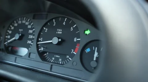 Close up view on car dashboard with blinking green arrow, turn light indicator Stock Footage 65724771