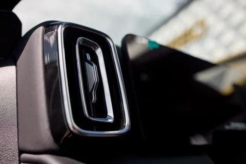 Close view of car interior air vent with chrome trim, glossy black grille Fotos Stock