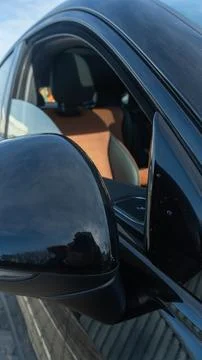 Close up view of car interior and side mirror. Modern vehicle interior with.. Stock Photos