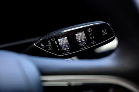 Close up view of car light switch control. Headlight switch, turn signal leve Stock Photos