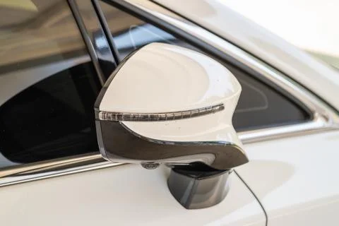 Close-up view of a car side mirror urban environment automotive detailed desi Fotos de archivo