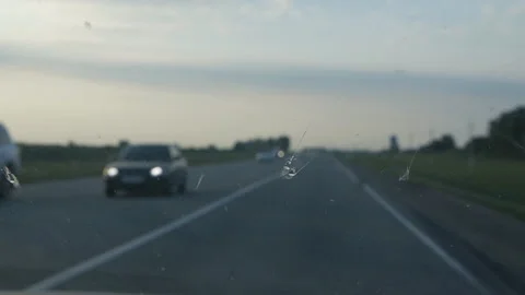 Close-up view from car through windshield driving along the highway Stock Footage 137821605