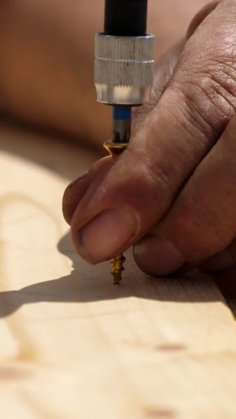 Close view of carpenter screwing with electric screwdriver Stock-Footage 321540150