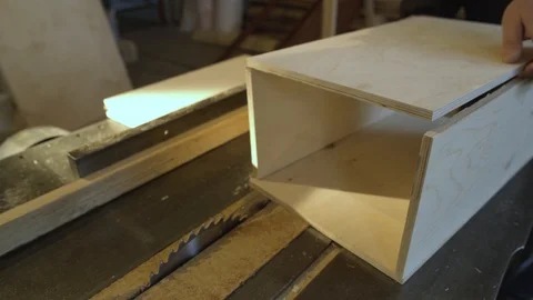 Close Up view of a carpenter using a straightedge to draw a line on a board Stock-Footage 107615085