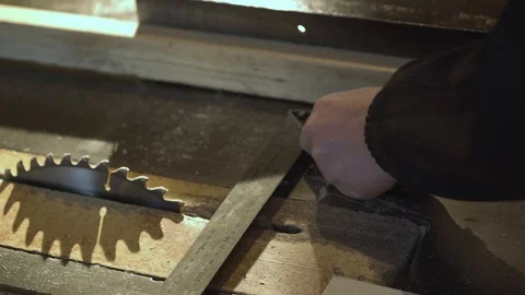 Close Up view of a carpenter using a straightedge to draw a line on a board Stock-Footage 107615161
