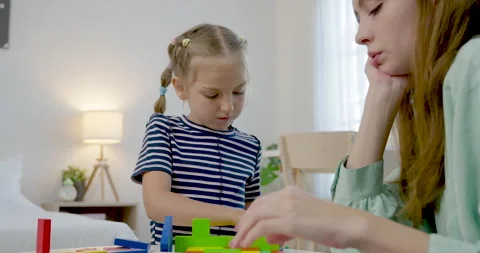 Close view of caucasian single mother coaching preschool daughter as child Stock-Footage 335764843