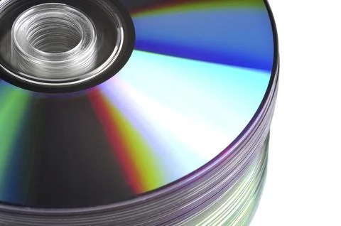Close up view of a CD/DVD stack on a mirror 写真素材