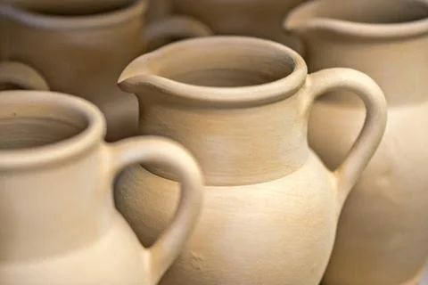 Close-up view of ceramic dishware Close-up view of ceramic dishware in pot... Stock Photos