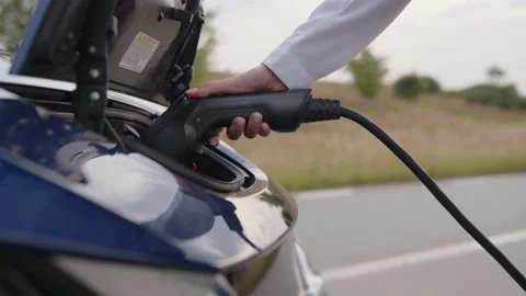Close up view of a charging electric car Stock Footage 158294451