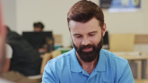 Close up view of cheerful bearded man communicating with bank assistant, asking Stock Footage 105257233