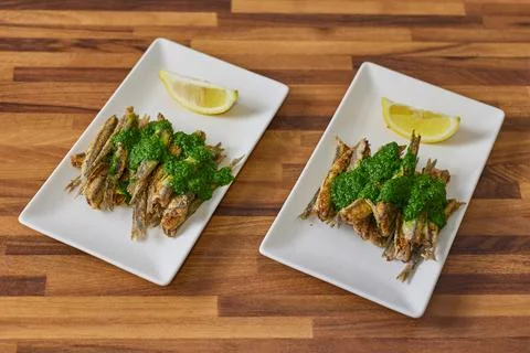 Close-up view of chef cooking anchovy fish Stock Photos